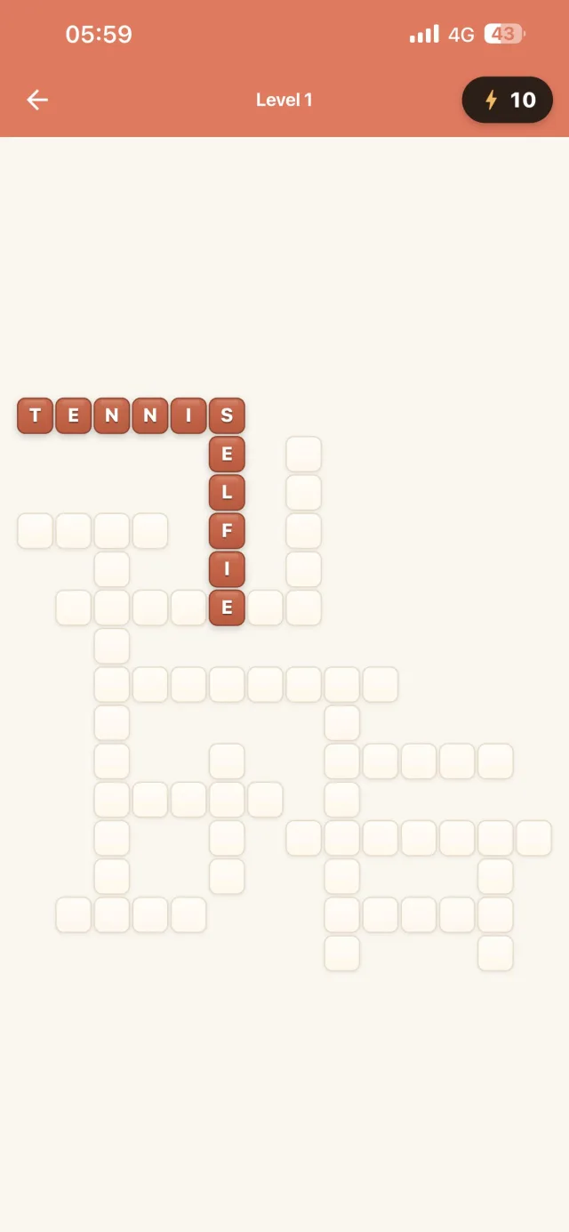 Crossword grid in progress with TENNIS and SELFIE filled in